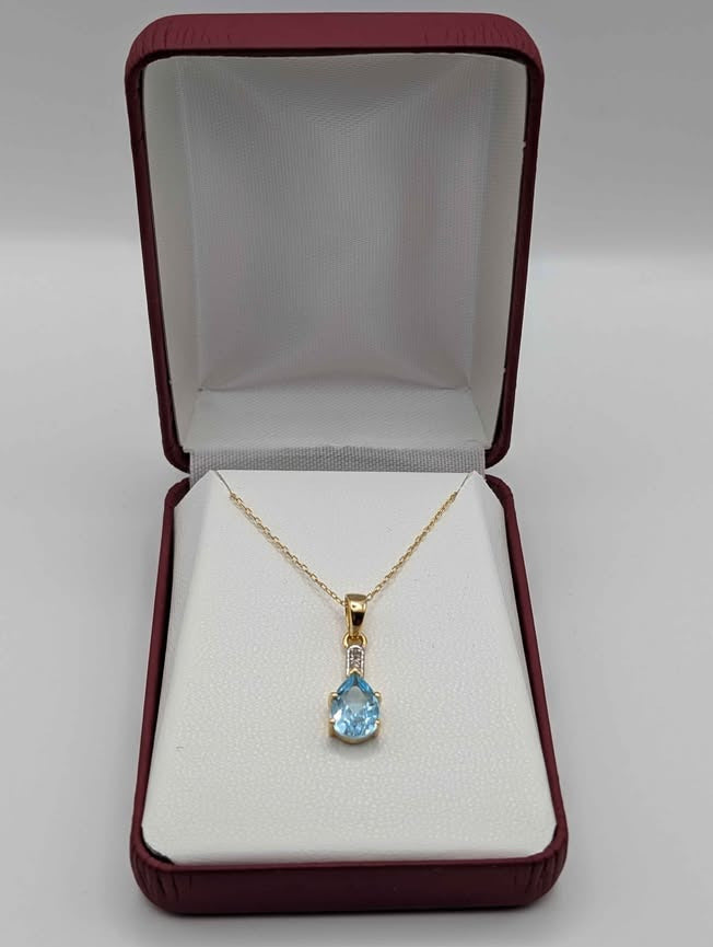 Eye Catching Blue Topaz Pendant on Gold Plated Sterling Chain