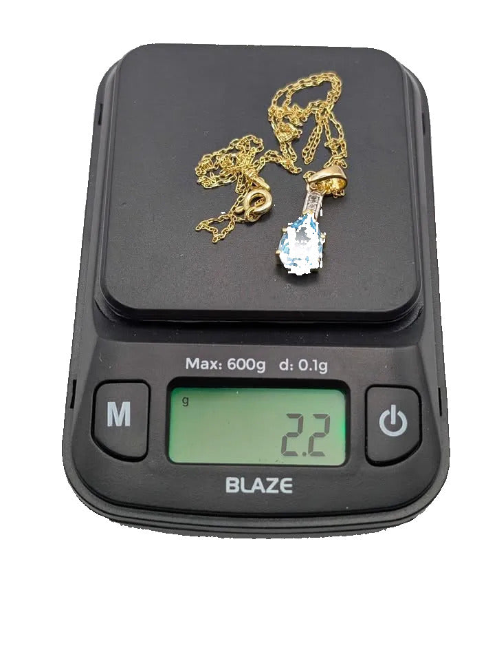 Eye Catching Blue Topaz Pendant on Gold Plated Sterling Chain